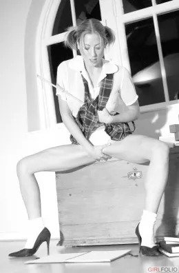 Milly at Girlfolio | Milly teaches us how to spell one of her best assets and gives the Teacher?s cane some capital punishment!.