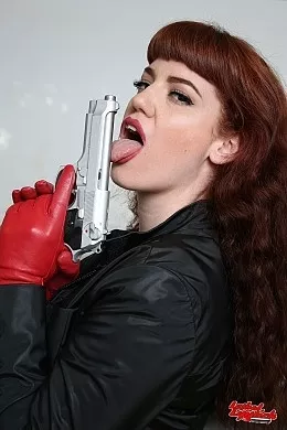 Zoe Page at Lethal Lipstick | Zoe Page posing by the sofa with red leather gloves