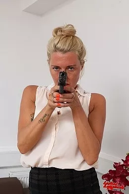 Charn at Lethal Lipstick | Charn poses in her office looking lethal