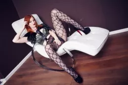 Zara Du Rose at More Than Nylons | Gotta love a redhead in tights haven\'t you? Particularly one who is all flustered and feathery too. I have a feeling you might week like to have a good look at Zara here, it\'s not often that she loses her cool. But on a shoot with MTN? Well, she just couldn\'t help herself.