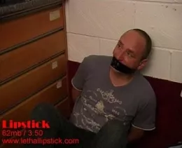 Lipstick at Lethal Lipstick | Clair wants to look her best, look her most lethal and she prepares herself slowly and thoroughly. What on earth does she want from her bound and taped victim?