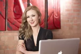 Sam Tye at More Than Nylons | Sam loves to look over her past work sometimes, which is what she's doing here. But looking at all of the images reminds her of how she felt at the time. Lucky for you, Sam is wearing a gorgeous outfit to show you just how much fun she had. With the shortest of dresses and highest of holdups, Sam won't be the only one feeling hot.