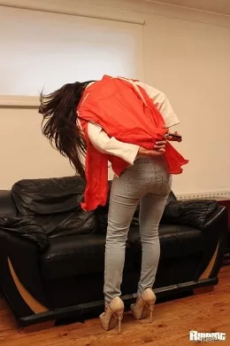 Jess West at Ripping 4 Fun | Jess West teases us in her front room with a nice ripping tease  from her tight blue denim jeans, slowly tearing them from the legs up before pulling them off her hips, bit by bit and then destroying her red jacket, top and bra