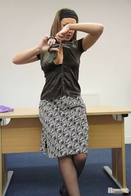 Office Secretary Cate Harrington at Ripping 4 Fun | Office Secretary Cate Harrington is in a ripping mood and as she moves around her desk to the front, to give us a much better view, she starts destroying her office clothing!