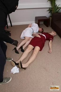 Zoe Page & Ariel Anderson at Damsels in Peril | The two nurses are happily chatting away in the staff room, talking about the days events and both of them completely unaware of the bandit lurking behind them. Within moments, their world is turned upside down as the both wake to find themselves stripped, bound and gagged