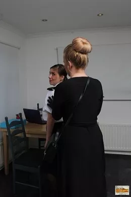 Karen Wood at Damsels in Peril | The WPC was found sitting at her desk. She hadn't noticed that she was being watched and it is only when she has almost finished her report, sat at her desk, that the assailant strikes, bundling the officer into her home and putting her plan into action..