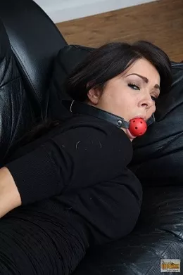 Charley at Damsels in Peril | Sexy young lady Charley finds herself all trussed up and gagged. She tries to escape but all to no avail, so we   get to watch her squirm and wriggle and muffle!