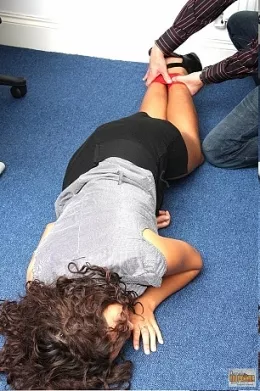 Office Secretary Bound And Gagged at Damsels in Peril | Bexey is too busy chatting with friends on the phone to worry about typing up her bosses letter, but when her boss discivers her in the middles of idle chitter chatter, he decised there more than one way to get her working!