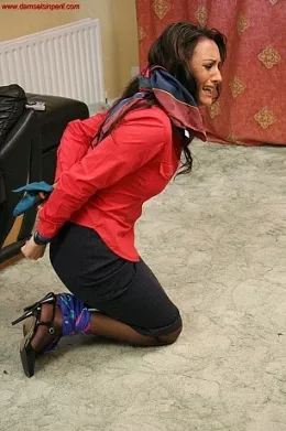 Bound In Satin at Damsels in Peril | Danni R wakes to find herself bound and gagged with satin scarves. She terrified, she doesn't know what happened and fight against the soft satin ties in a determined effort to escape!