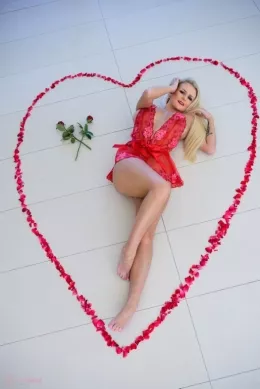 Lycia Sharyl at Lycia Sharyl | Happy Valentine's Day to all my lovely members. I hope you all have a fabulous day, spoil your loved ones and get spoilt back in return. Be sure to be generous, gentlemanly and romantic. And whatever you do, remember to pay for it all! I dug out this set of pictures from my 2019 calendar shoot, made in a luxury villa in Cyprus. My assistants were up and beavering away whilst I was attending to my makeup. They carefully picked dozens of rose petals and laid them out into this Lycia sized heart on the tiles. As you can see, we took a lot of pics! Why so many? Well for a calendar picture you want the very best image from a batch and the time is in the setting up and styling and theme and costume / outfit changes etc. Once a set is prepared, taking a few hundred pictures does not really need more time than taking (say) 20-30 pictures. It is only a few extra clicks and a bit more posing from me. I wanted a clothed one and a totally naked one and I needed lots of different faces to chose from. We managed that. My photographer was standing on a kitchen stool, trying not to fall on top of me. He's a heavy sod so it would have seriously ruined my trip, possibly even knocked me out. It would also have wrecked the flower display. Thankfully it did not happen and we ended up with lots of spare pictures. Not wishing to waste them I thought you might like to scroll through for your special Valentine's gift from me. Roses are red, violets are blue, this site exists, to satisfy you. Mwa. Lycia xxx