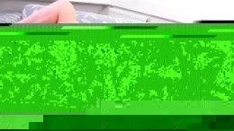 Zoe Page at Demure Fun | Redhead Zoe Page is sat on her sofa and it looks like she is almost ready for bed as she is just in her lace trim full slip. She looks delightful in her vintage lingerie and it's clear she is wearing a pair of black full back panties beneath