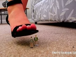 Kay at Tiny Fetish Fun | The tinies had made it into Kay's lounge and they were eager to see what this beautiful brunette Giantess was wearing beneath that dress of hers...but Kay spots them and in a moment, they are helpless, shaking and trembling at the soles of her feet and her very high, sharp, high heels