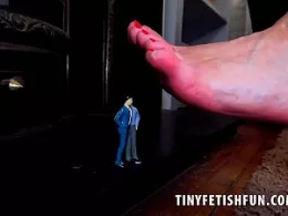 Bonnie Bellotti at Tiny Fetish Fun | Giantess Bonnie Bellotti is in charge as she towers over the collection of tiny guys, all standing up obediently at her feet shaking and quivering in fear of the giantess