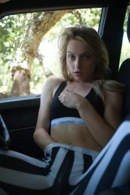 Chloe Toy at Girlfolio | Chloe gets herself more than a little overheated in this picture story.Chloe is out in her car wearing skin tight leggings, biker boots and a skimpy CK top.The engine overheats - so without more ado, Chloe pulls into a lay by and overheats herself whilst waiting for some road side assistance!The picture set gives a whole new meaning to 'In Car Entertainment'!