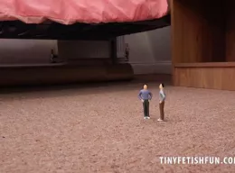 Morgan M at Tiny Fetish Fun | Giantess Morgan M  is in charge as she towers over the collection of tiny guys, all standing up obediently at her feet shaking and quivering in fear of the giantess