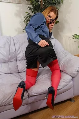 Isabella Rose at Upskirt Glamour | Isabella steps forward with a naughty glint in her eye wearing a secretarial outfit comprising; silk/satin blouse/shirt, contrasting black knee length skirt, red bra and suspender/garter belt (BS), red stockings & suspenders, and black high-heeled court shoes that stay on throughout a tease and special treat that is absolutely guaranteed to leave your jaw on the floor - so if you are wondering what she is wearing under her skirt, you are about to be totally blown away!